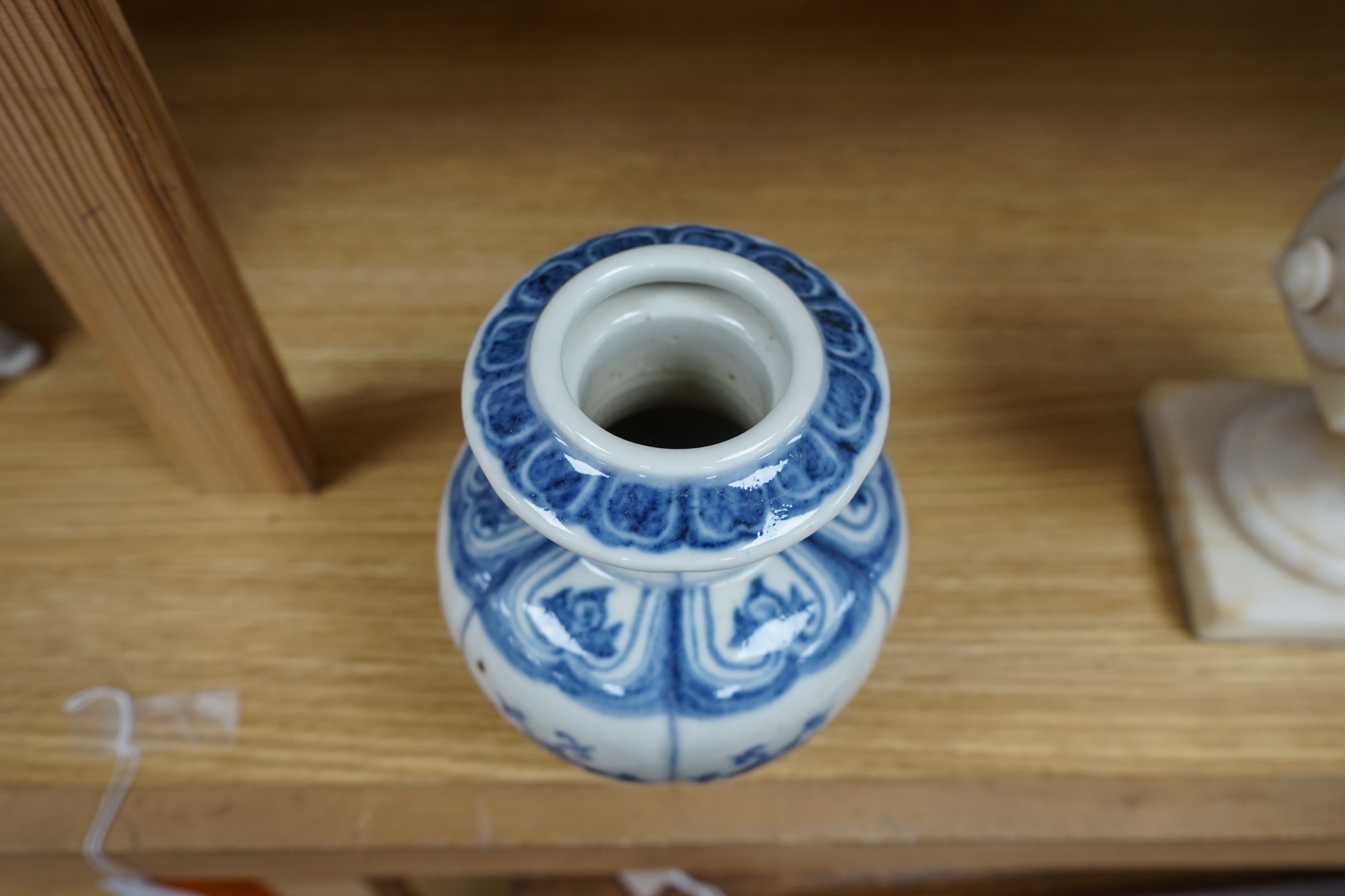 A Chinese blue and white bulbous vase 18cm high. Condition - good.